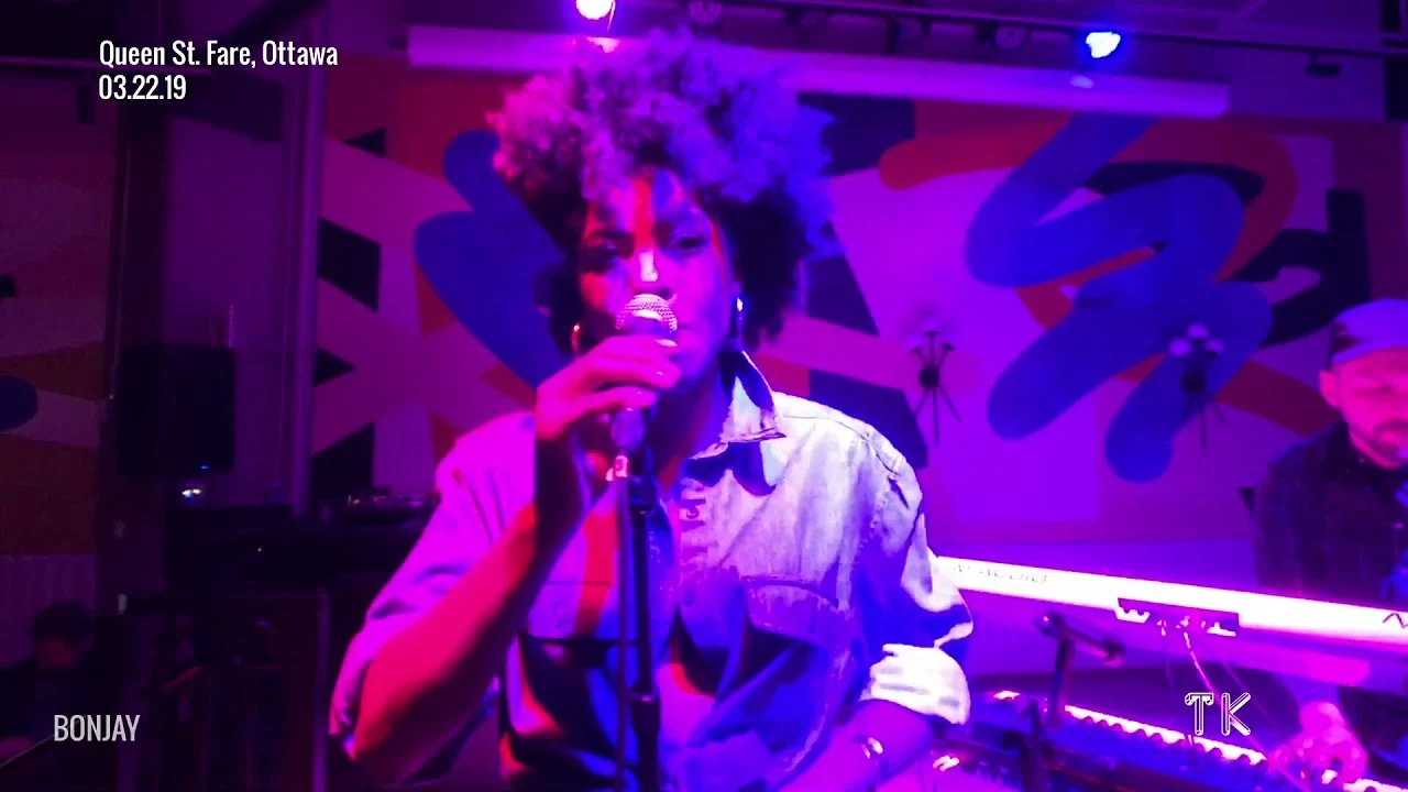 Bonjay performing at Queen St. Fare in 2019, with the original photo credit retained.